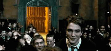 Cedric Diggory the Hugglepuff strutting through the Great Hall