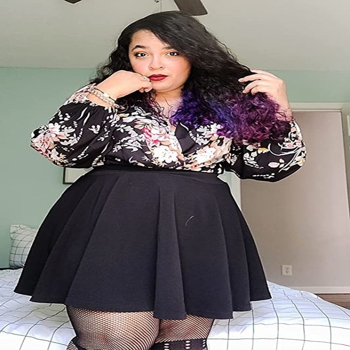 Reviewer wearing the black casual flared skater skirt