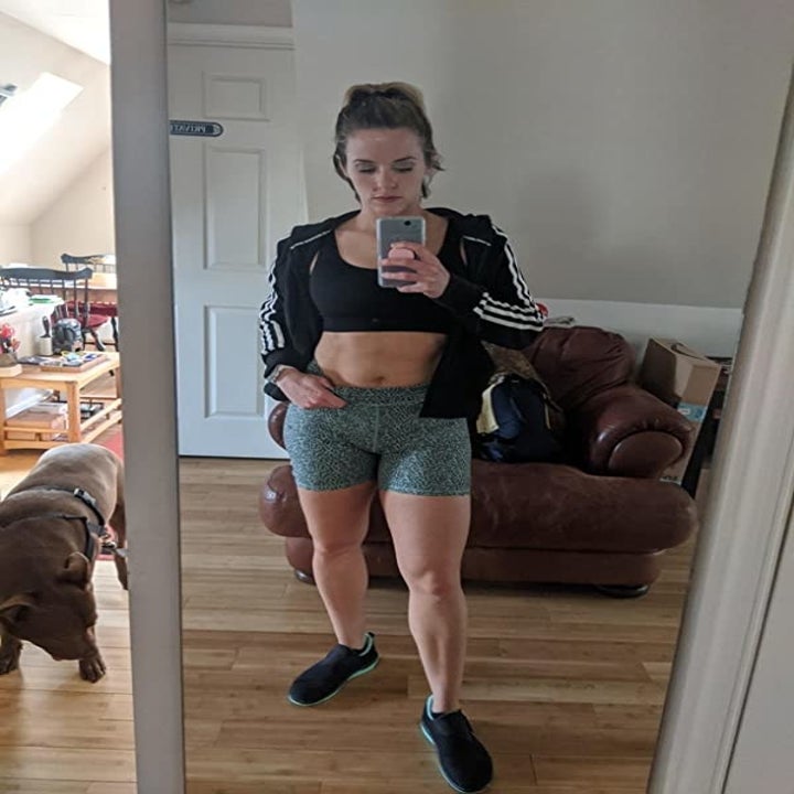 Reviewer wearing the bean green leopard shorts