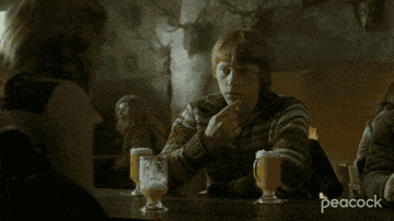 Ron tentatively pointing out Hermione&#x27;s butterbeer mustache