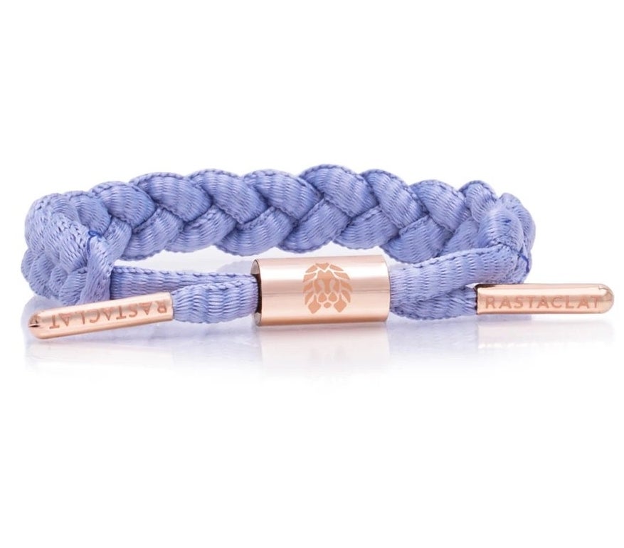 a lavender braided bracelet with rose gold accents