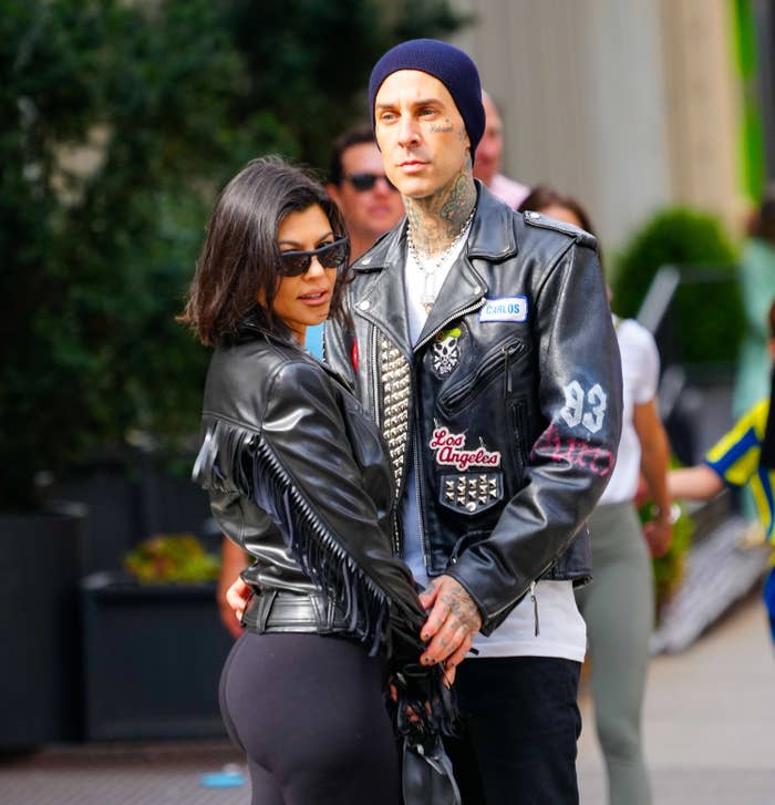Kourtney and Travis standing outside together