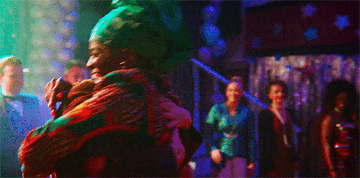 Ncuti Gatwa as &quot;Eric&quot; and Asa Butterfield as &quot;Otis&quot; are hugging happily on the dance floor