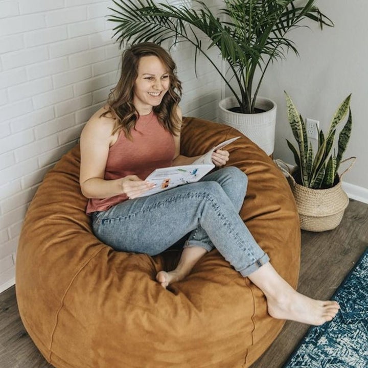 A person sitting in an oversized bean bag chair