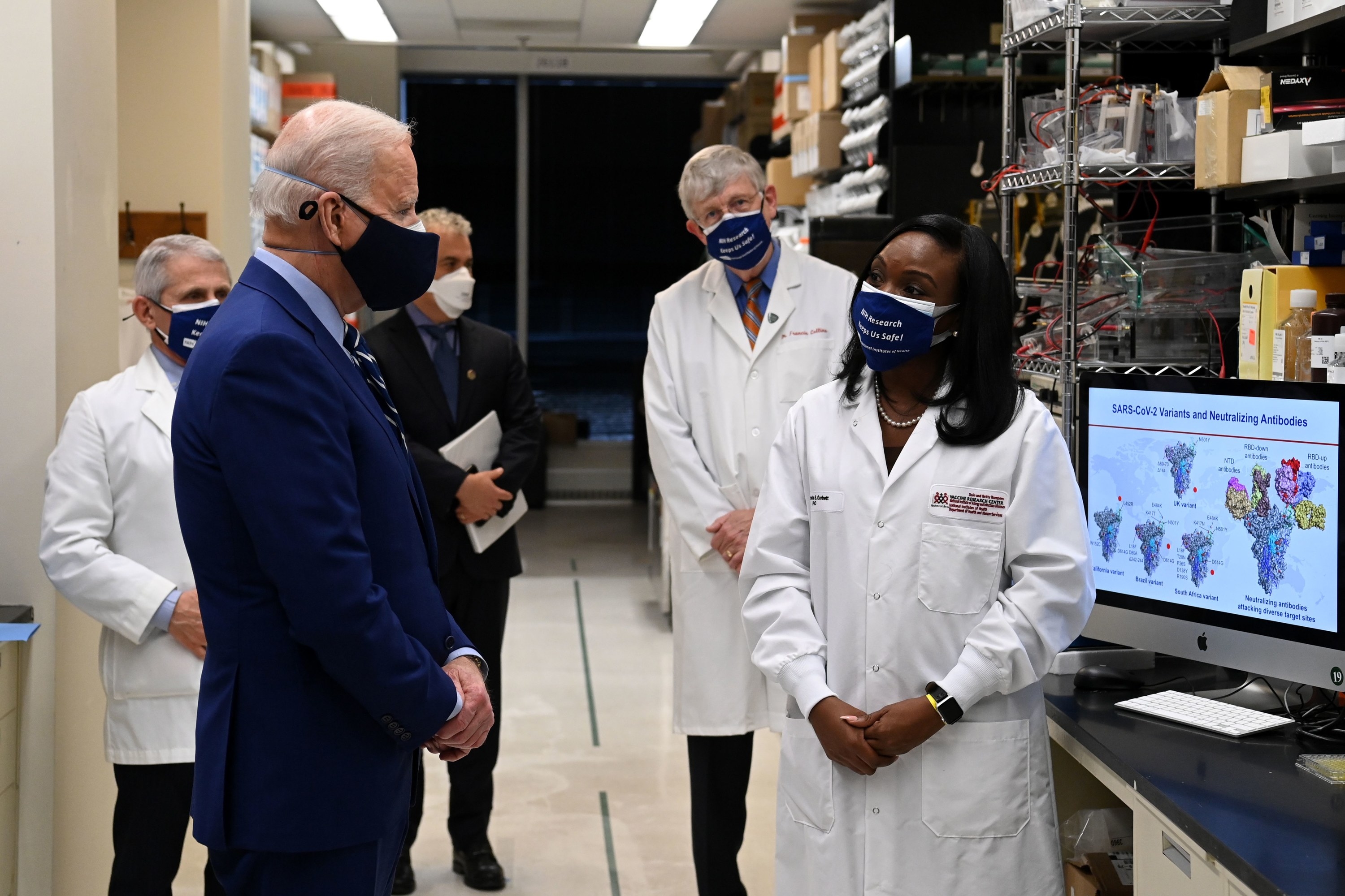 US President Joe Biden with Dr. Kizzmekia Corbett in a lab setting