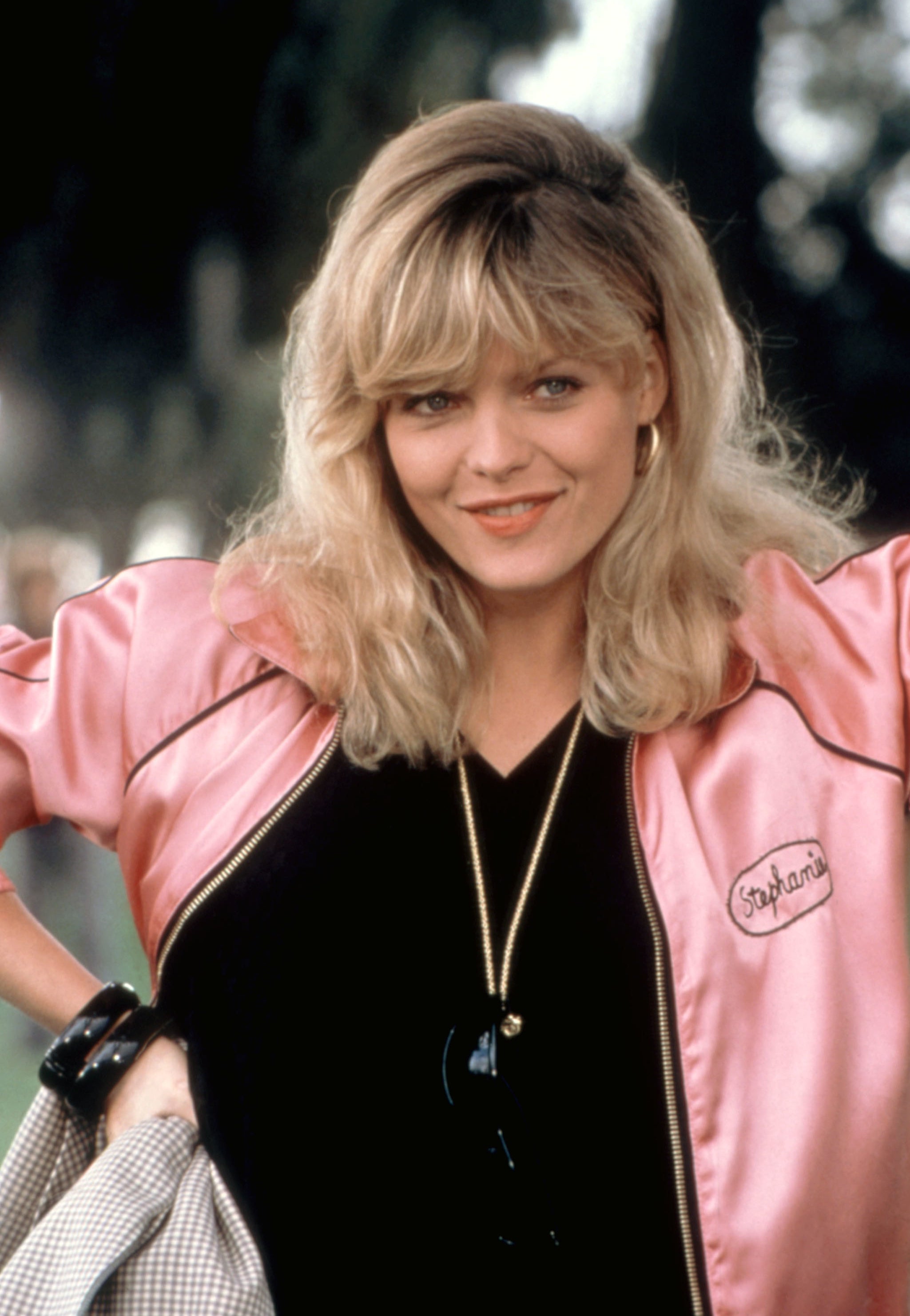 Michelle Pfeiffer in &quot;Grease 2&quot; wearing a bright pink jacket that says, &quot;Stephanie&quot;