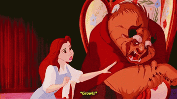 Belle trying to clean the Beast&#x27;s wound but he growls at her