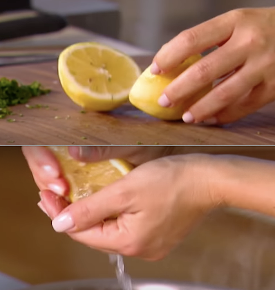 Chef adding lemon juice to a dish