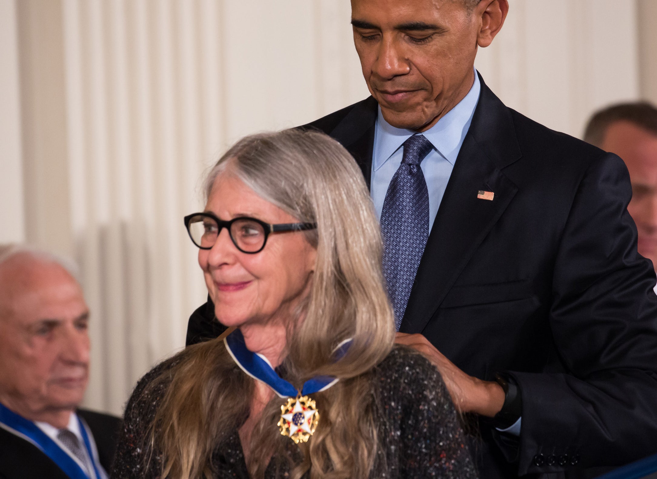 President Barack Obama placing the Presidential Medal of Freedom on Margaret Hamilton, who is smiling
