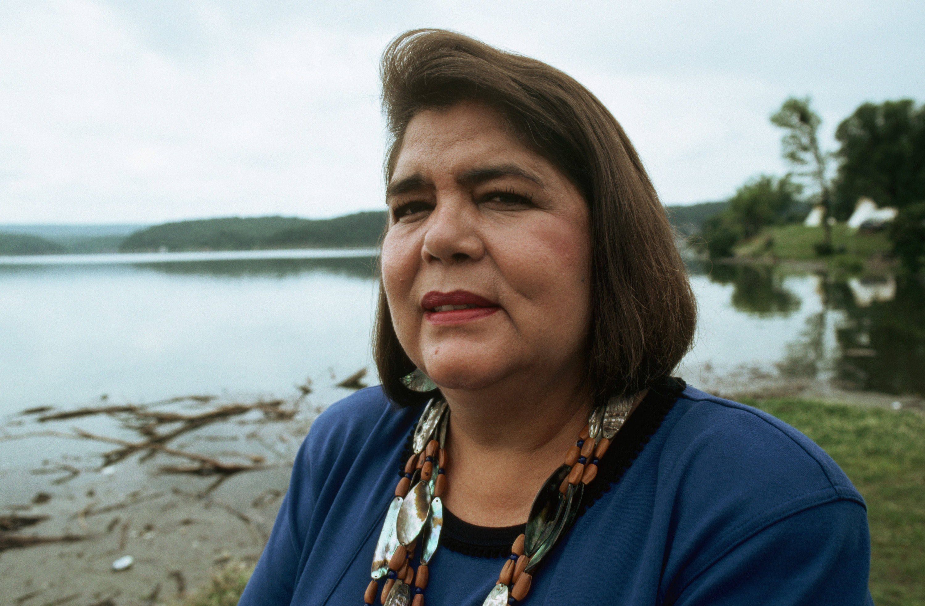 Chief Wilma Mankiller, of the Cherokee Nation standing by a lake