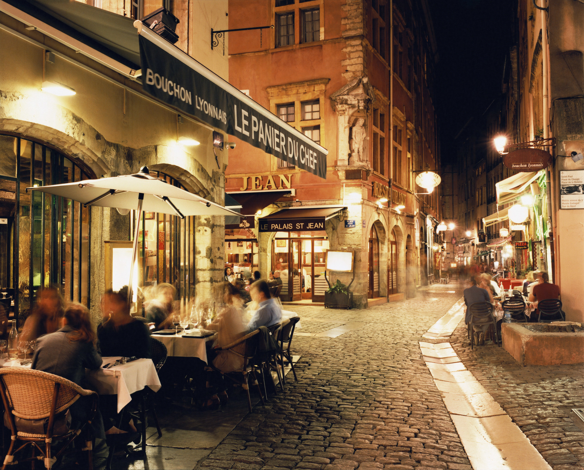 People sitting outdoors at a French bistro