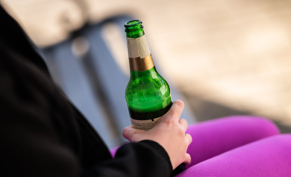 Someone holding a bottle of beer