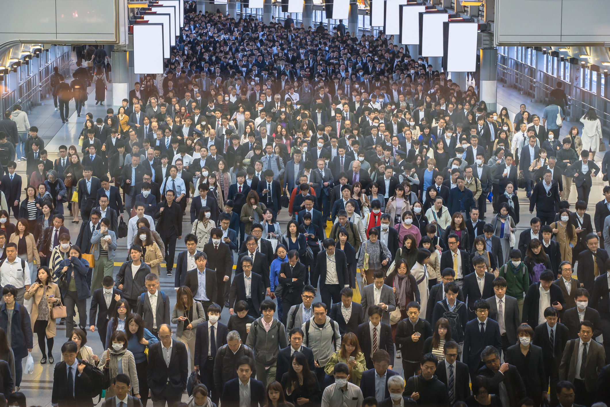 A huge crowd of people wearing suits