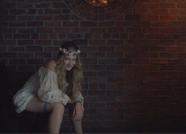 A still of Jemima Kirke of &quot;Girls&quot; sitting on a toilet