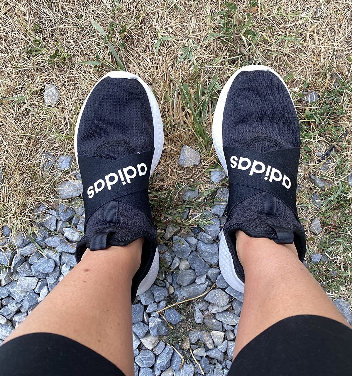 Reviewer wearing the black adidas running shoes