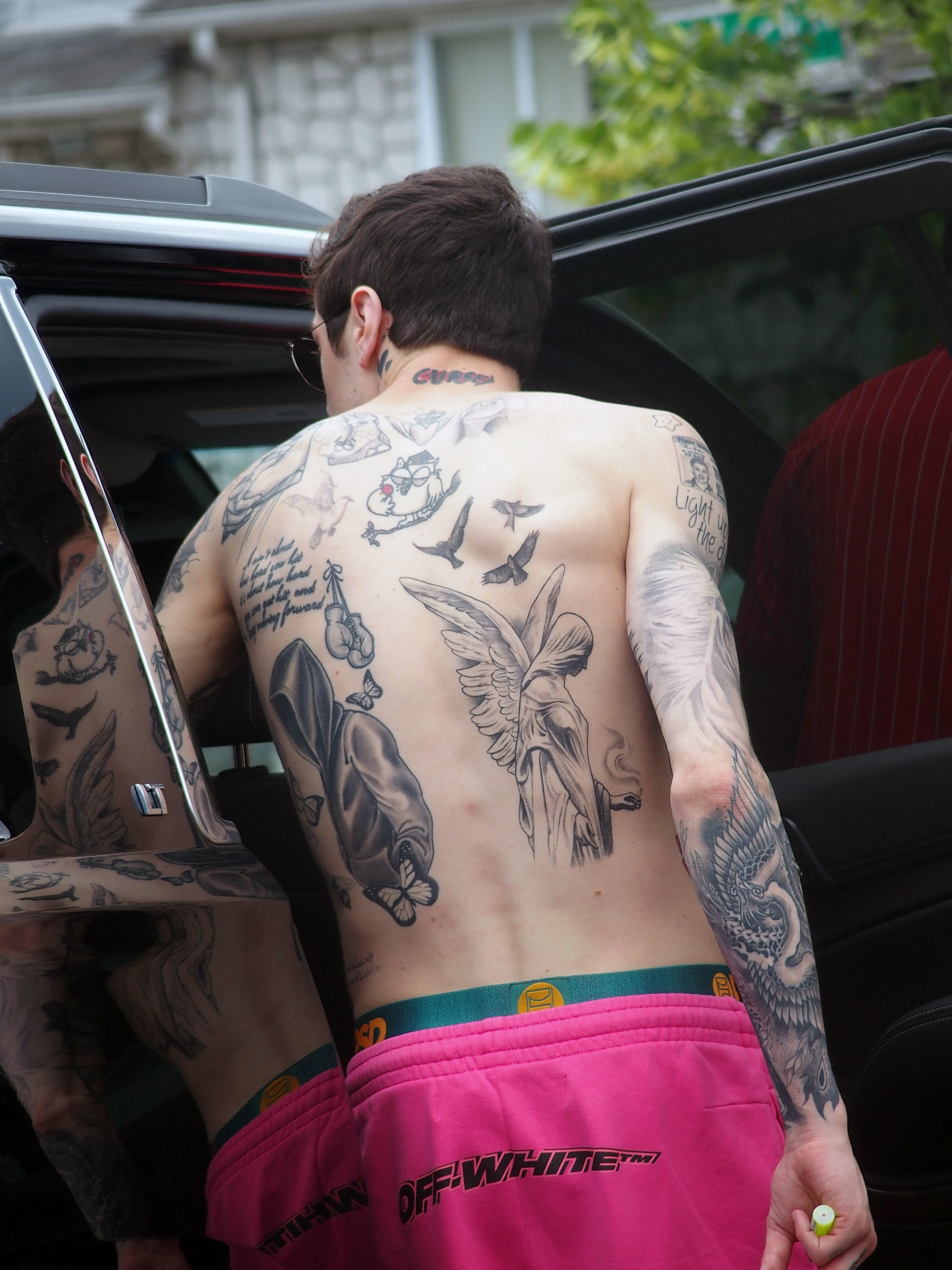 A photo of Pete shirtless from the back