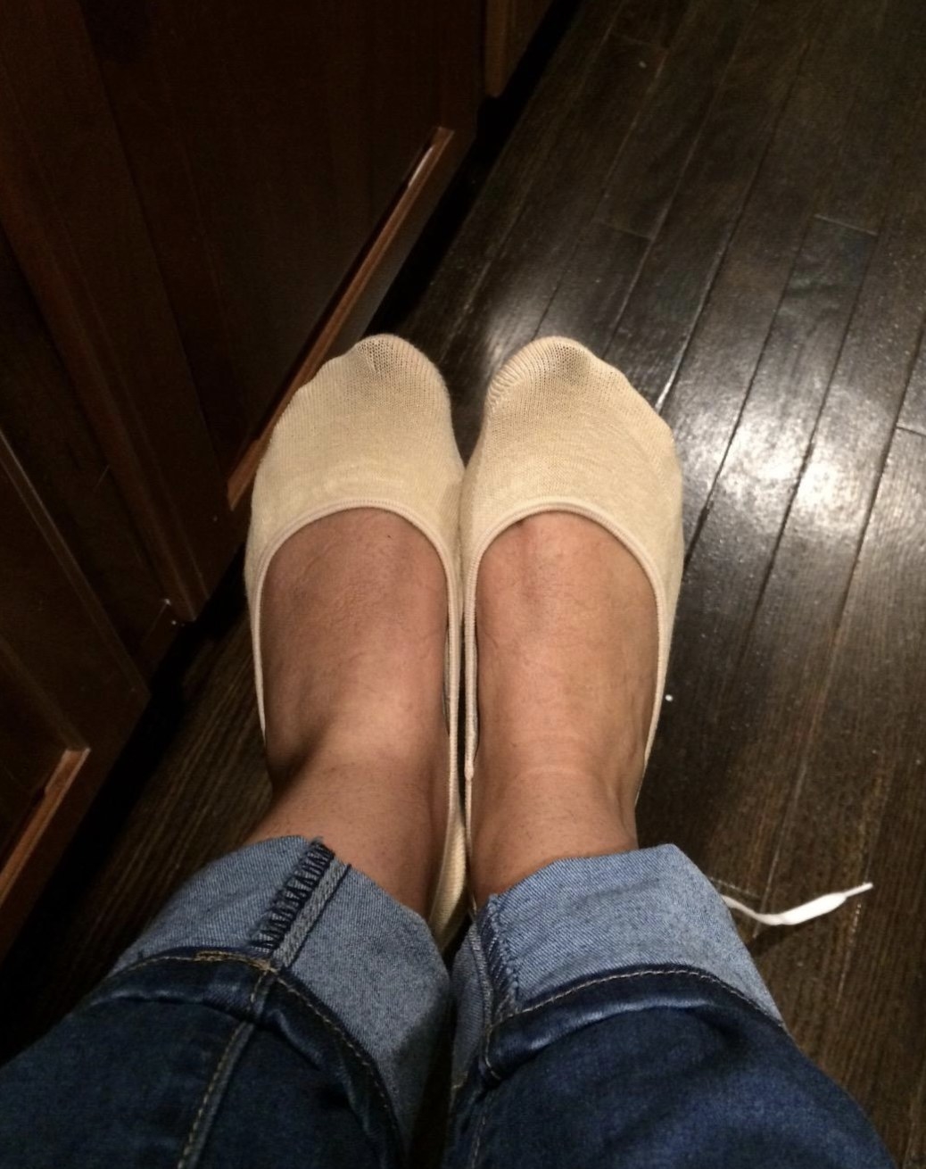 a reviewer wearing the socks in beige