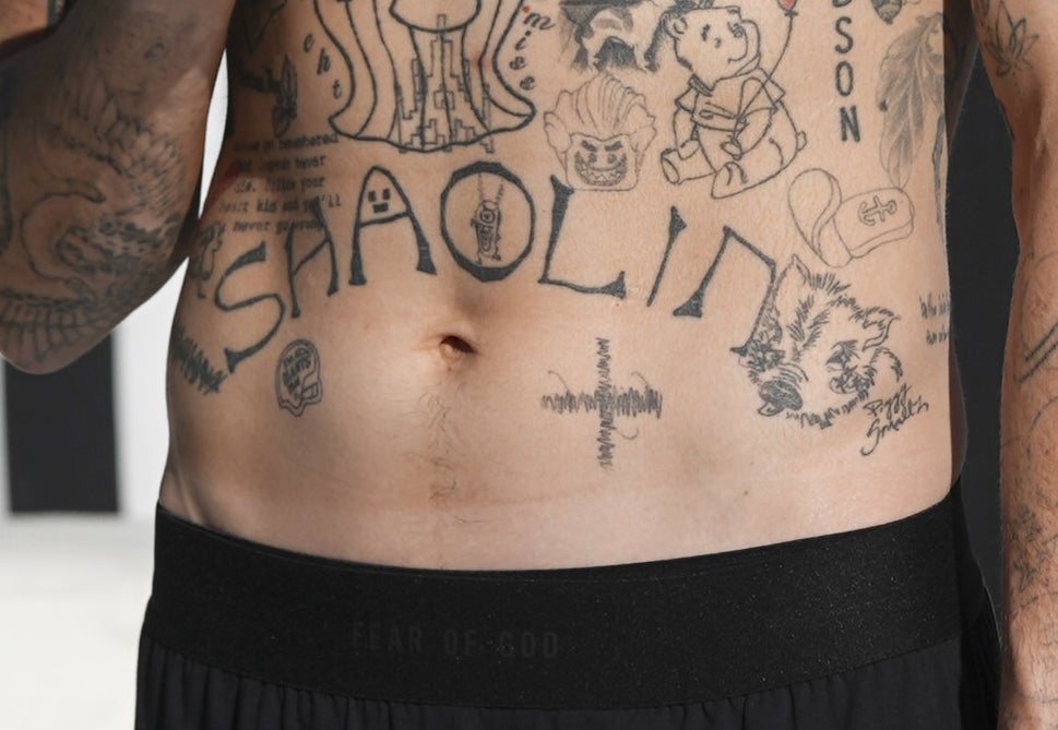 A closeup of the tattoos described
