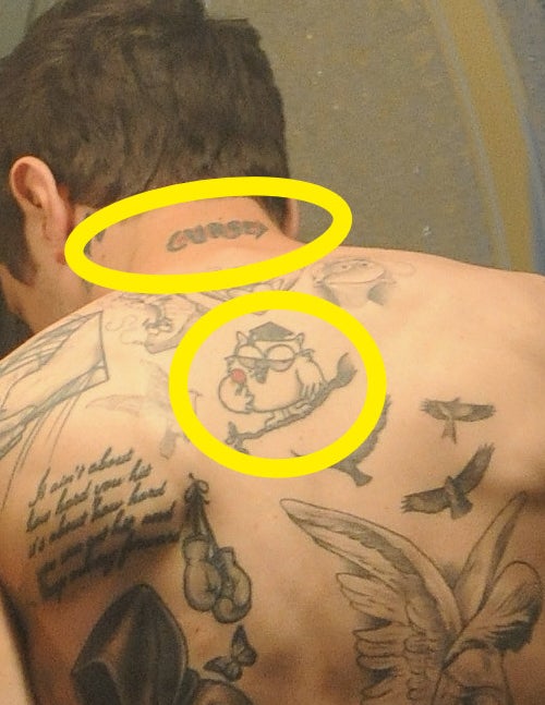 A closeup of the tattoos described