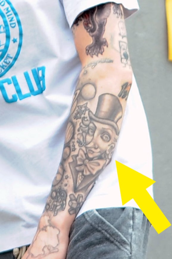 A closeup of the tattoos described