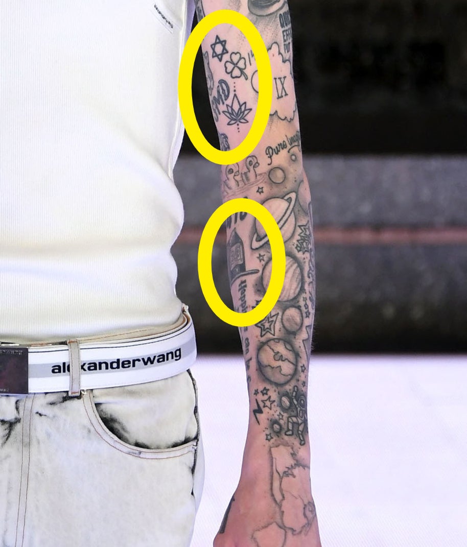 A closeup of the tattoos described