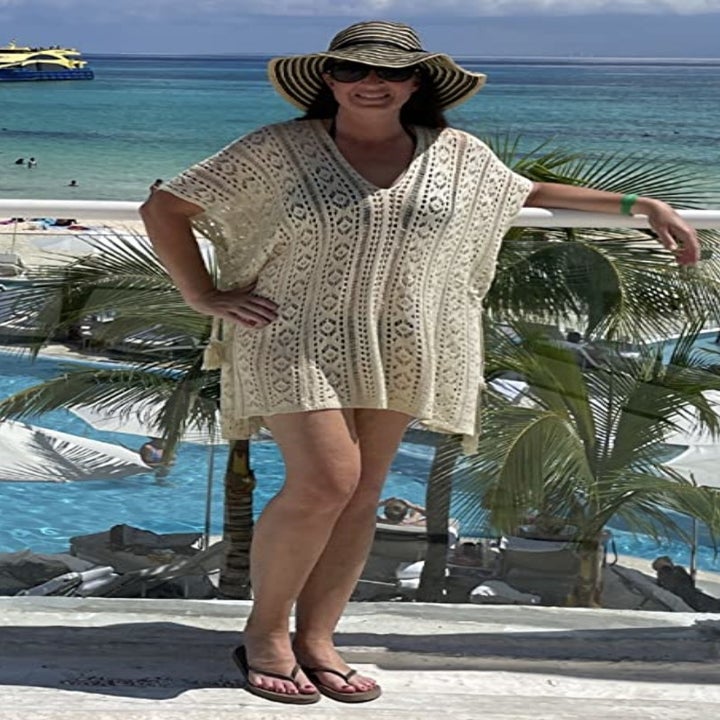 a reviewer wearing the cover up in cream