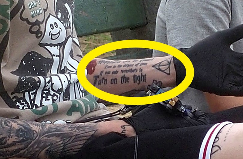 A closeup of the tattoos described