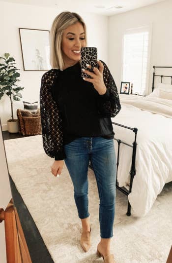 a reviewer wearing the top in black