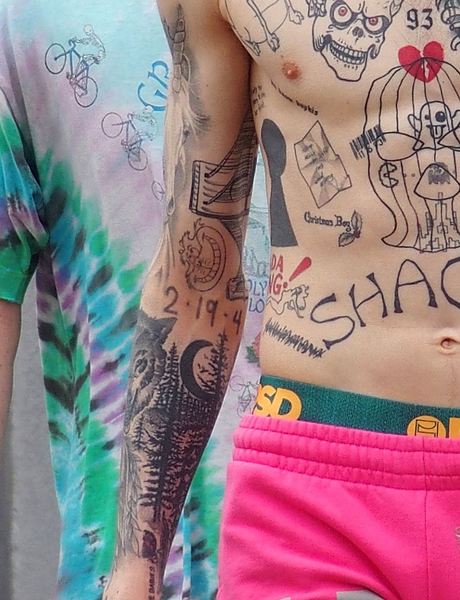 A closeup of the tattoos described