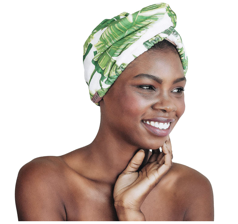 model wearing tropical leaf hair towel