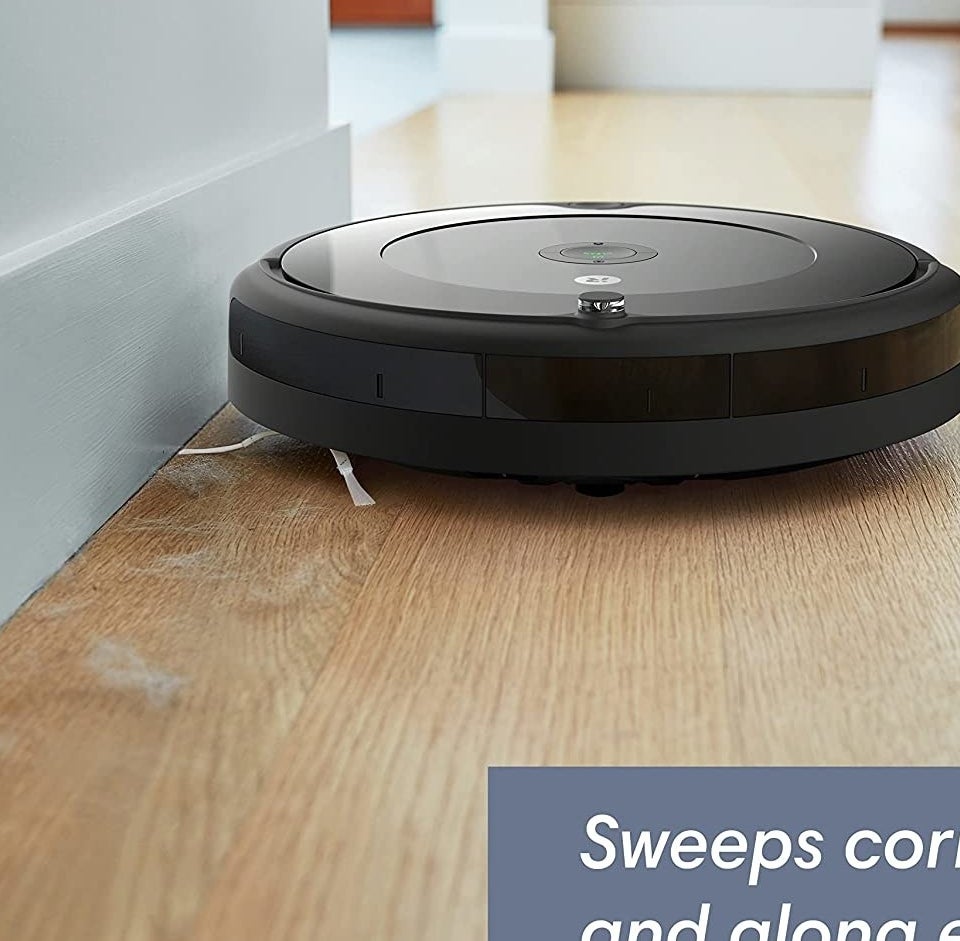 The Roomba cleaning dog hair off a wood floor