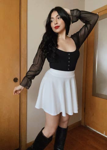 a reviewer wearing the skirt in white
