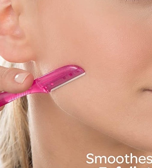 A person using the razor to get rid of peach fuzz on their jawline