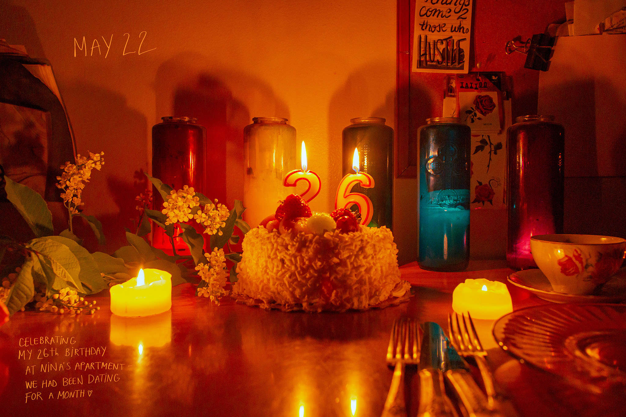 A birthday cake with candles two and six on it on a table top with text on the photo that reads May 22, Celebrating my 26th Birthday at Nina&#x27;s Apartment, we had been dating for a month