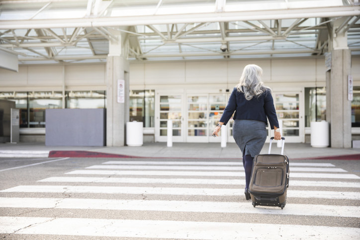 A woman walking into the airport