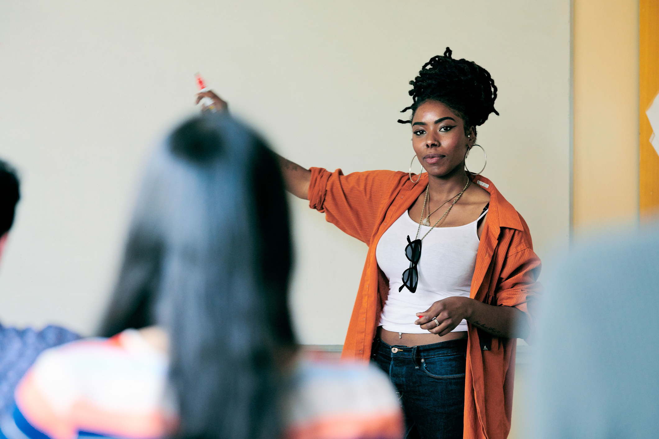 Student at the front of the classroom leading a presentation