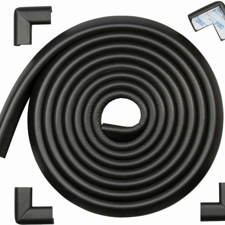 A rolled up black foam bumper with corner protectors