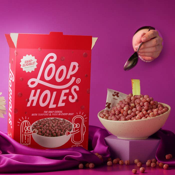 Loopholes Cereal Box next to a bowl of Loopholes cereal with tampons and pads inside the bowl