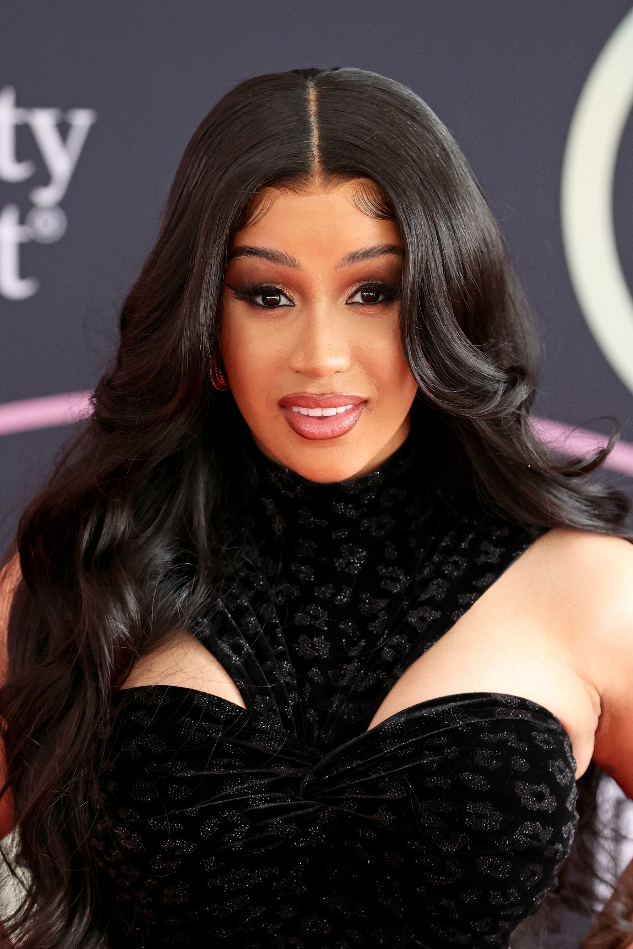 Cardi B poses on the American Music Awards red carpet