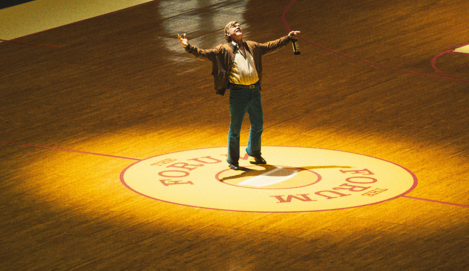 John C. Reilly standing on a basketball court in winning time