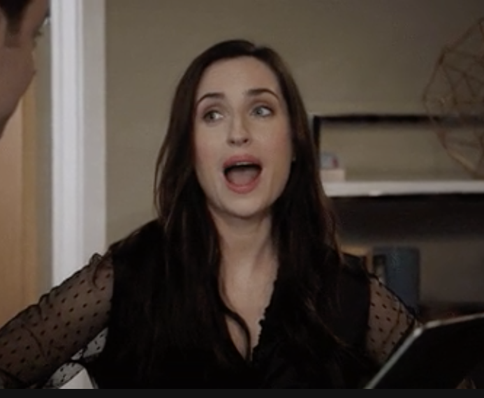 zoe lister-jones with her jaw dropped in shock