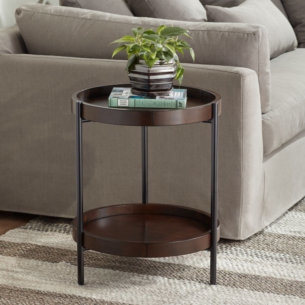 the brown accent table by a couch