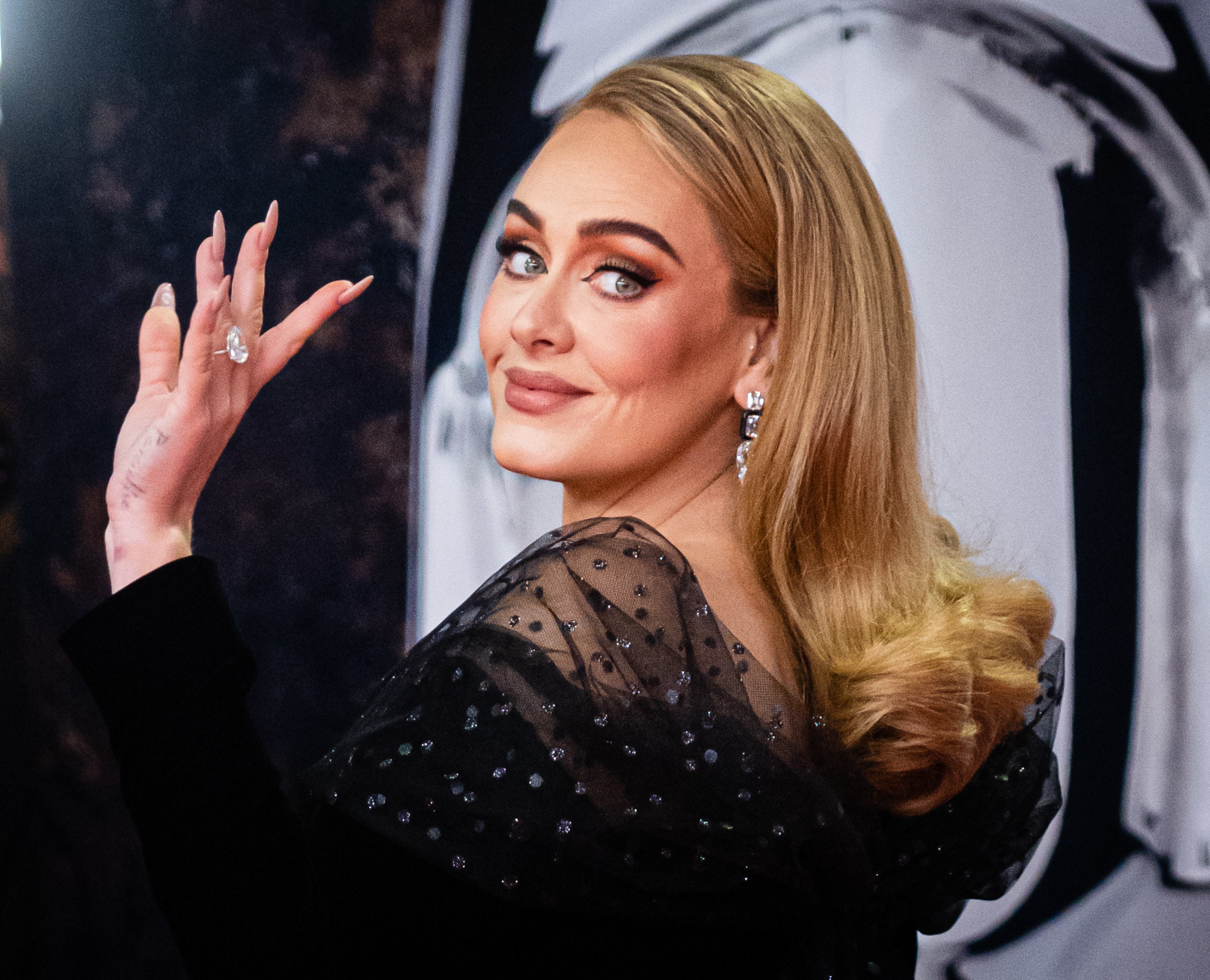 Adele waves at the 2022 BRIT Awards