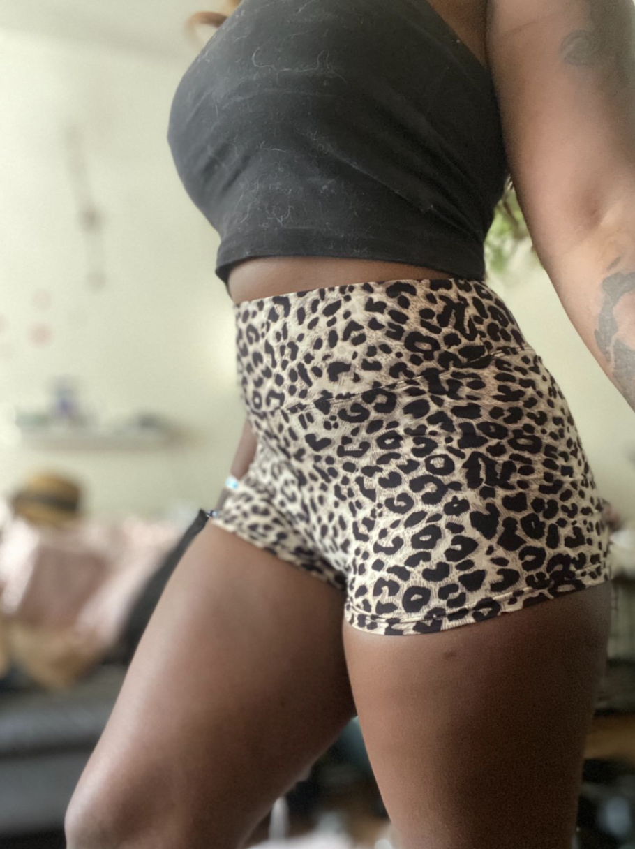 reviewer wearing the bike shorts in leopard print