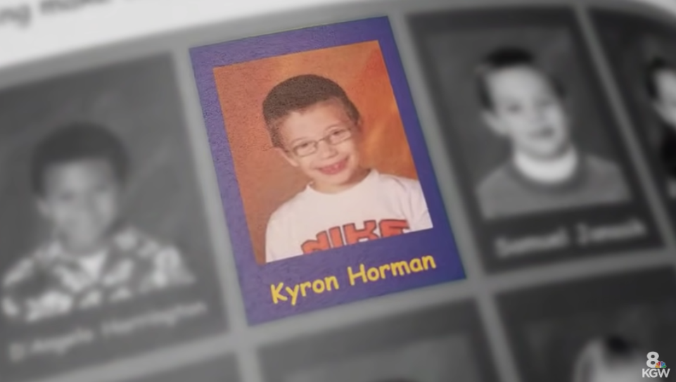 Kyron&#x27;s school photo where he has a shirt and glasses