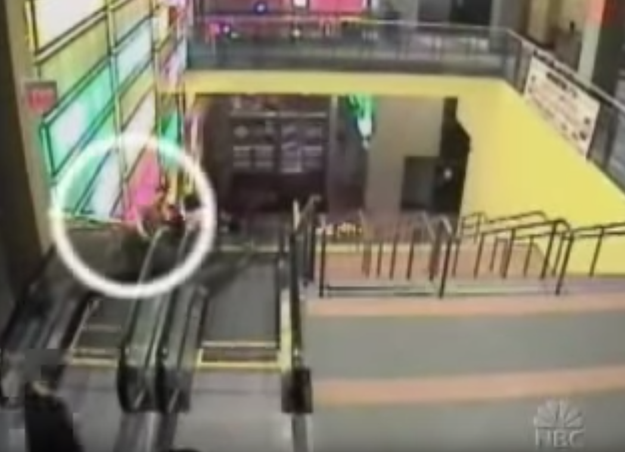 Camera footage of Brian going up an escalator