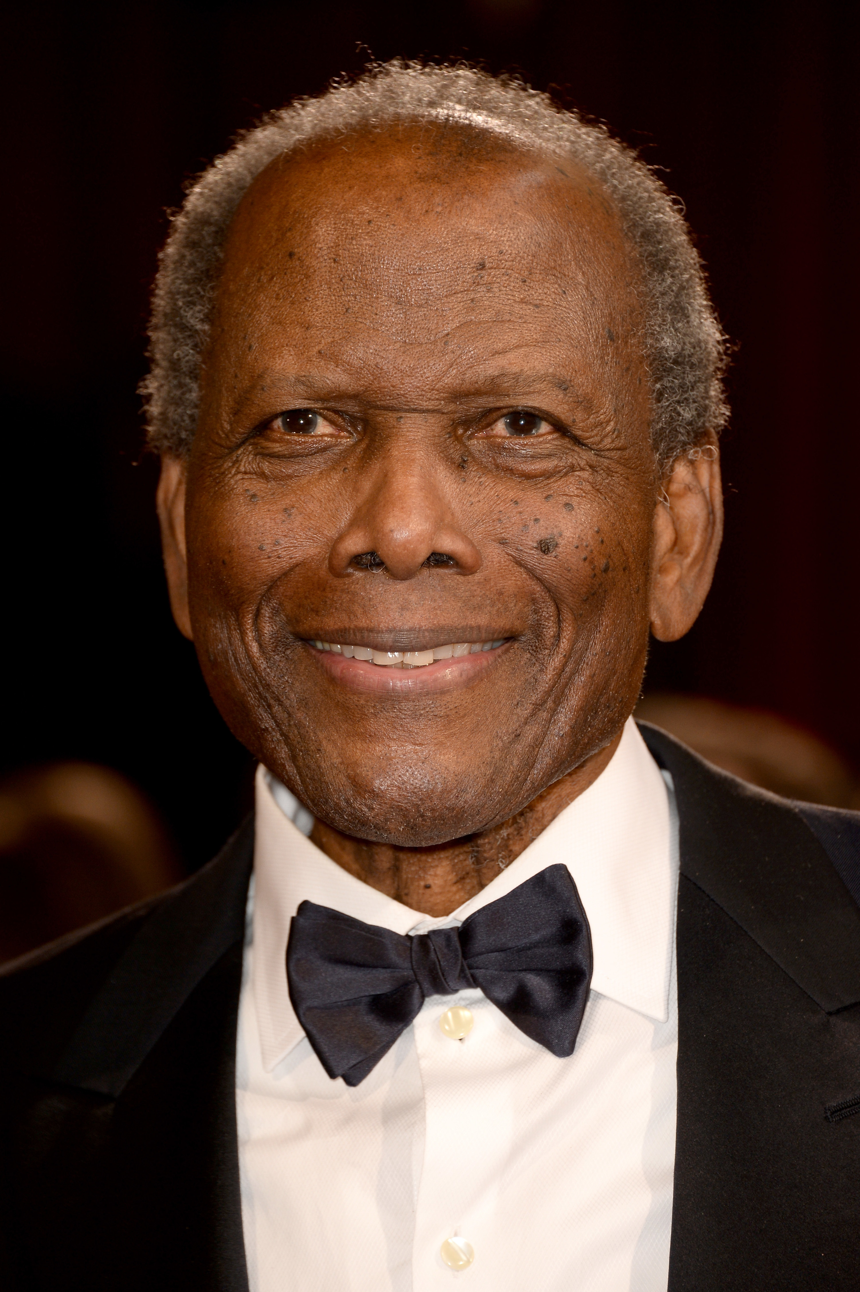 Sidney Poitier smiling at the 2014 Oscars