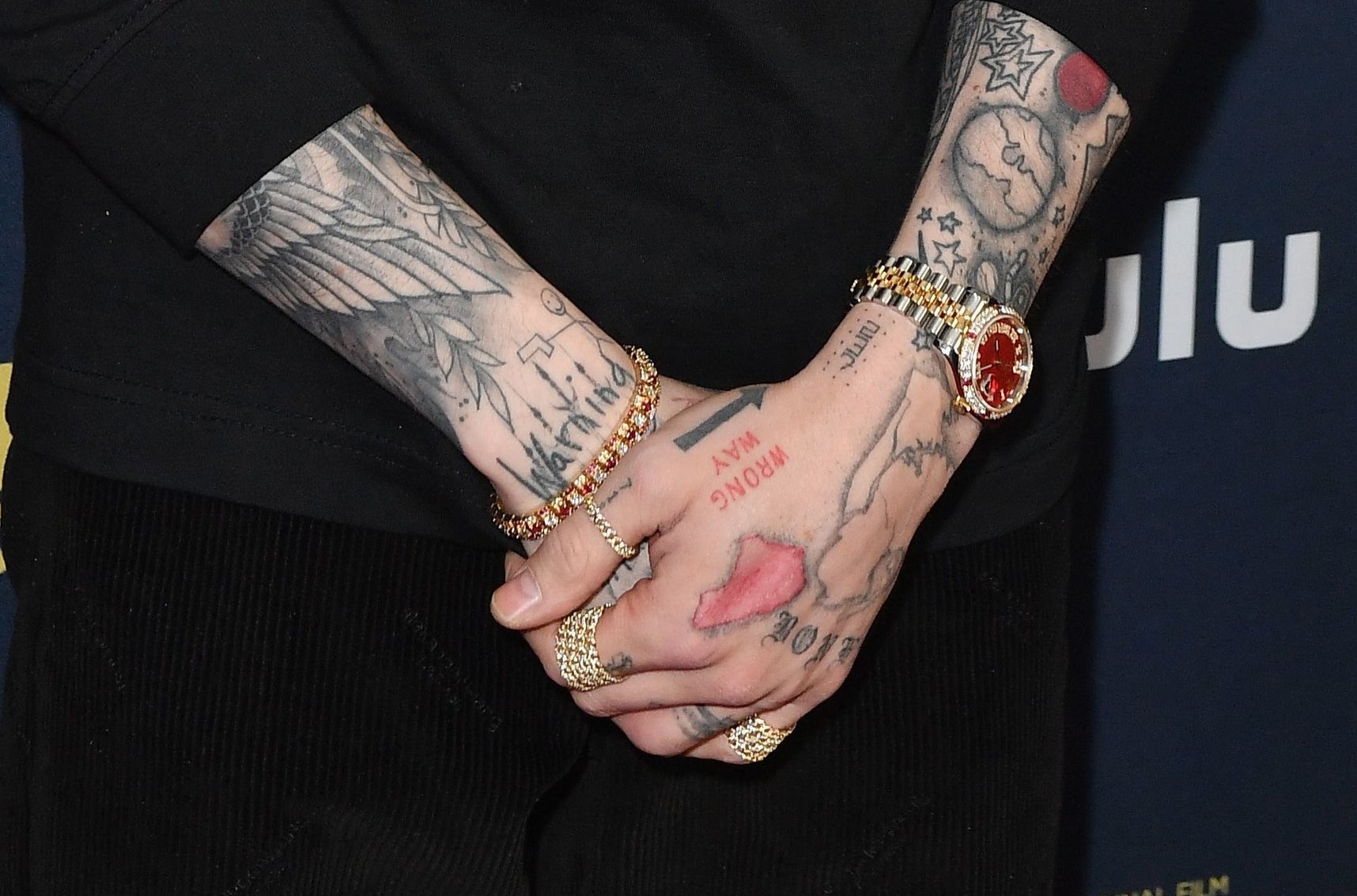 A closeup of the tattoos described