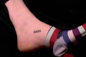 A tattoo on someone's foot that just says Greg