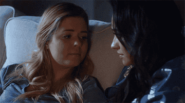 Alison and Emily kissing